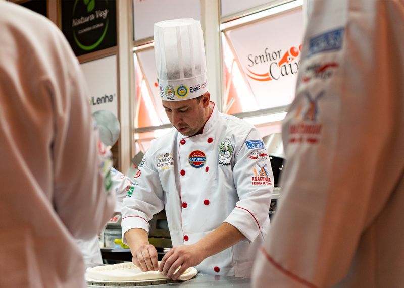pizzaluce pizza dough being hand-stretched by our chefs